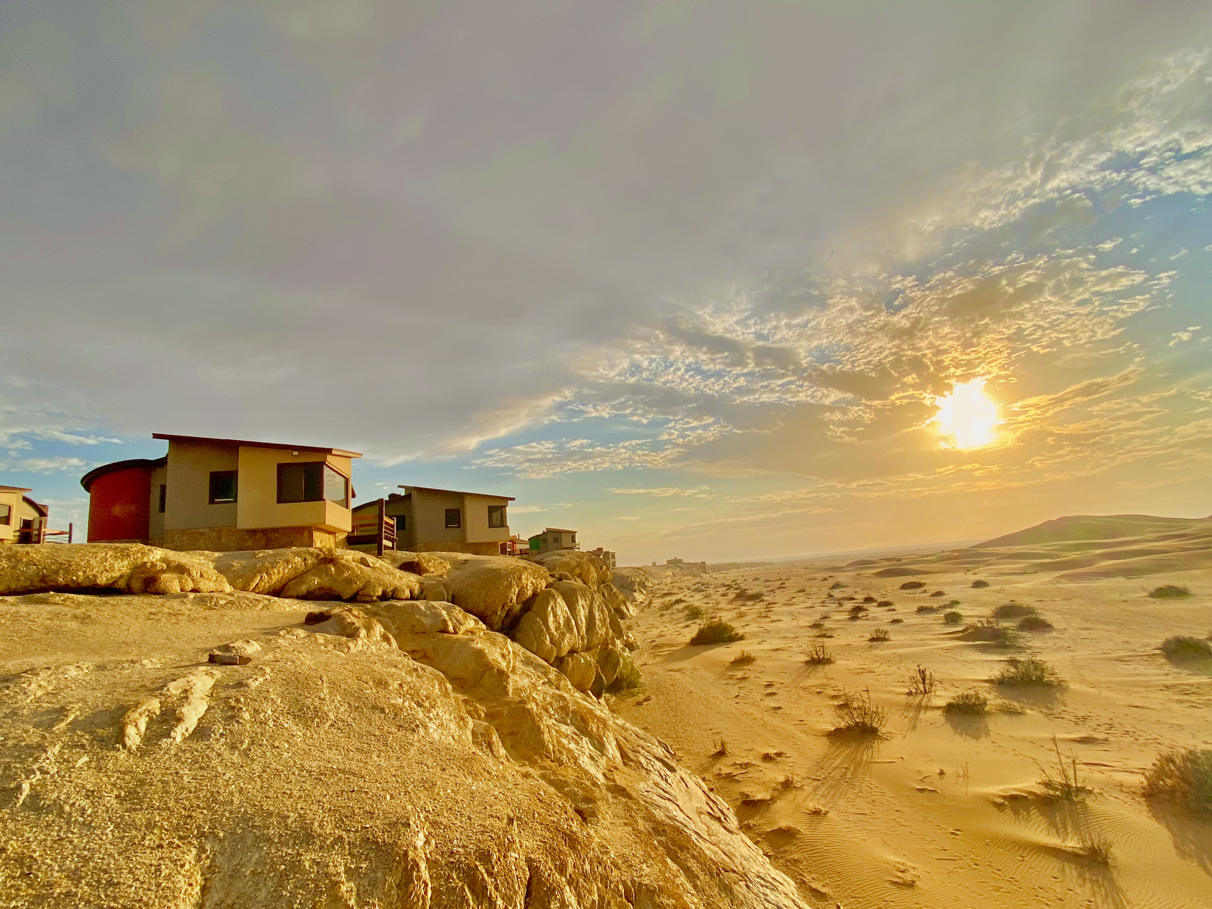 Desert Breeze bungalows overlooking the Namib dunes at sunset
