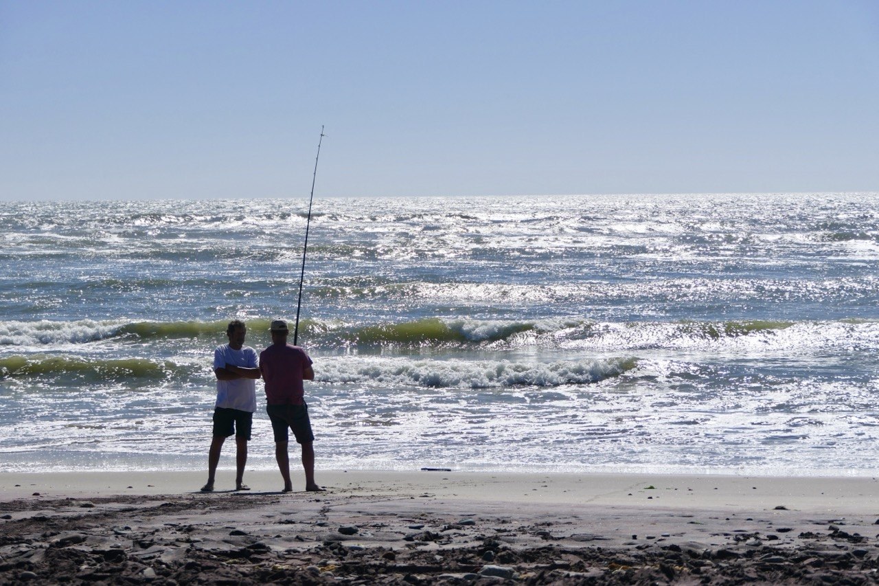 Fisherman fishing from the Atlantic coast