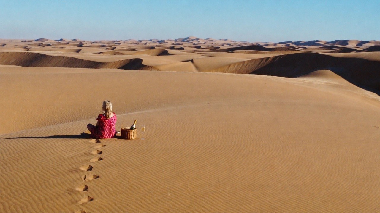 Sundowner drink on a dune