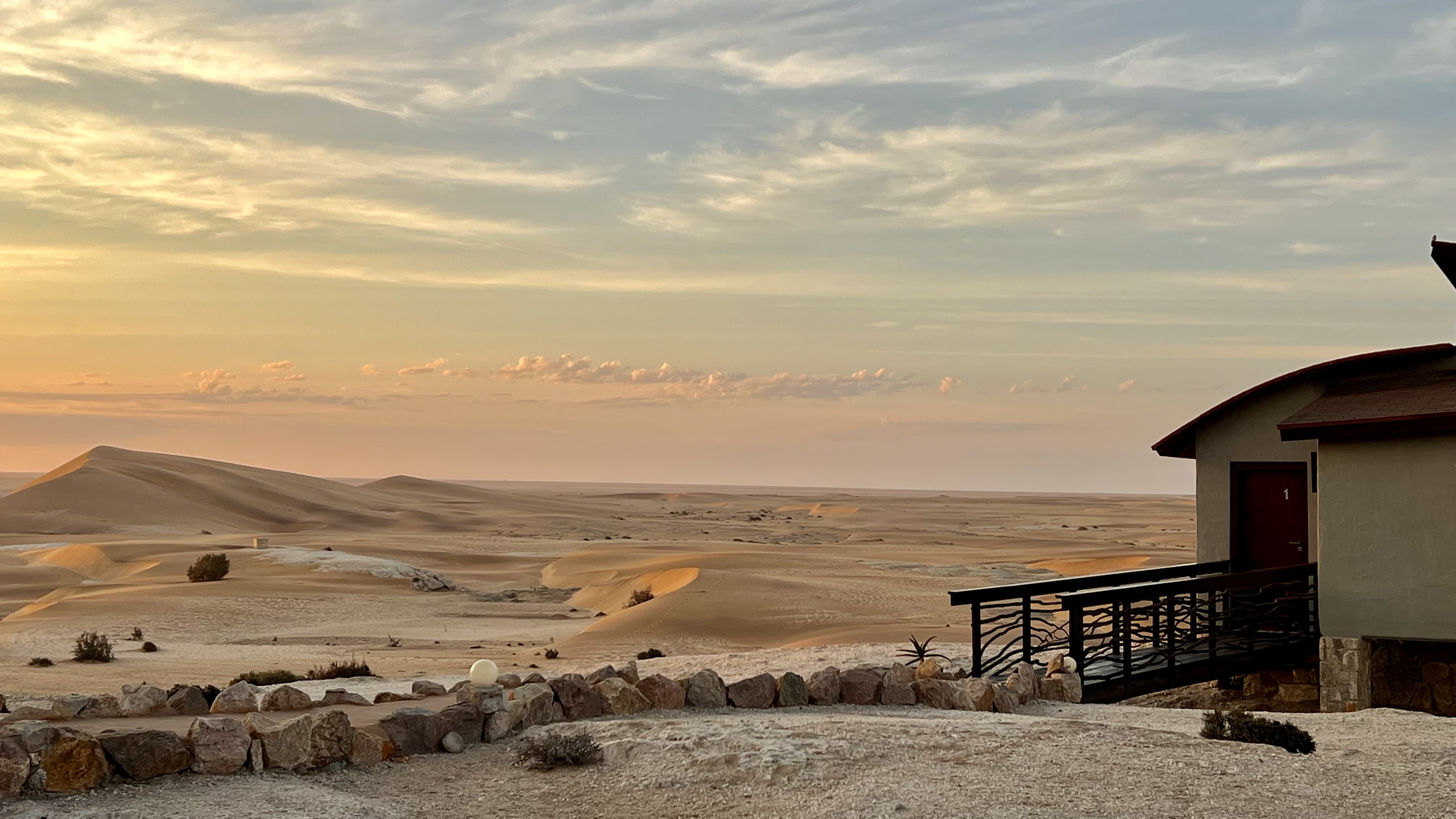Desert Breeze bungalow beside the Namib dunes at sunset