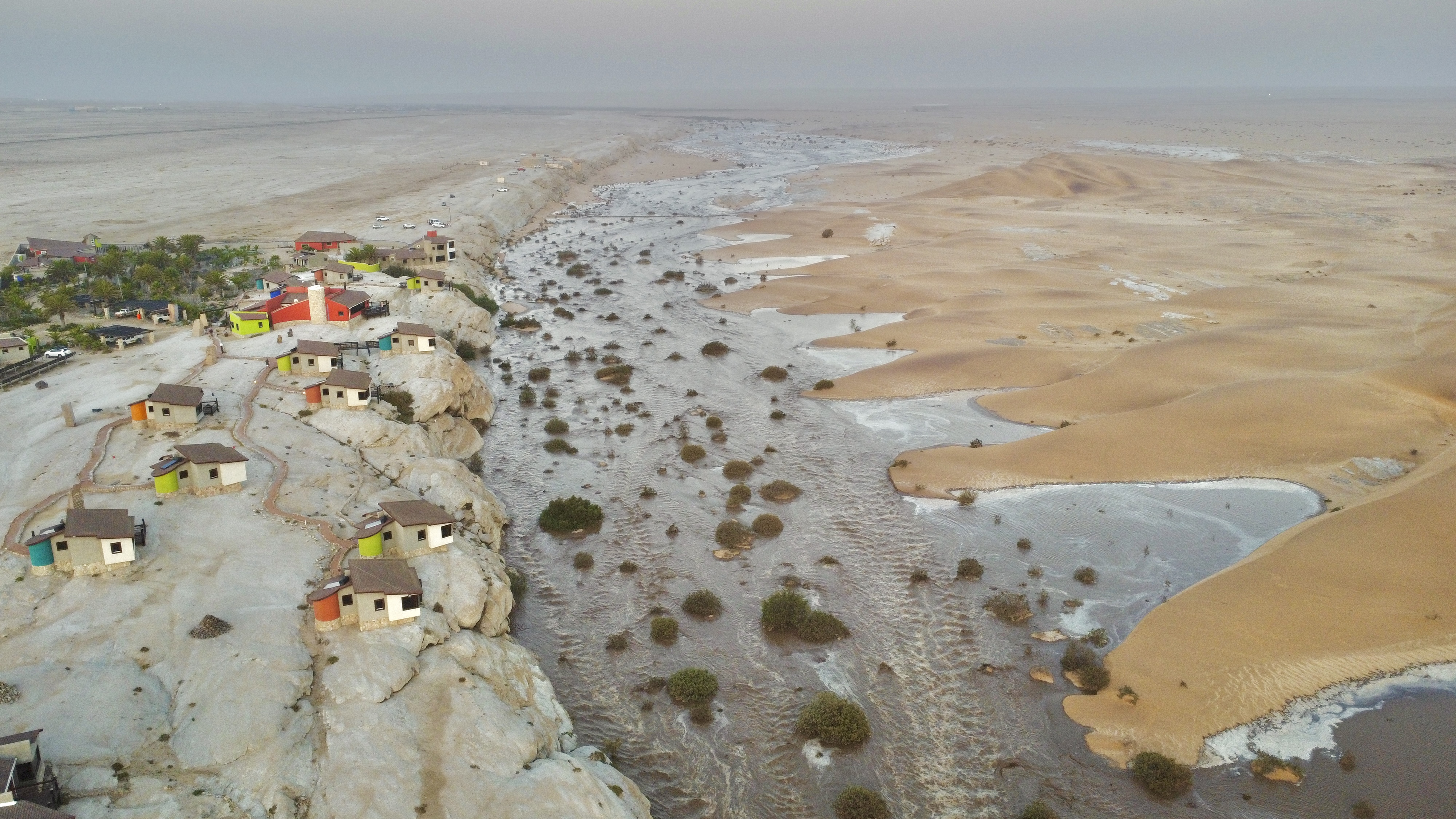 Aerial view of Desert Breeze Lodge beside the Namib dunes