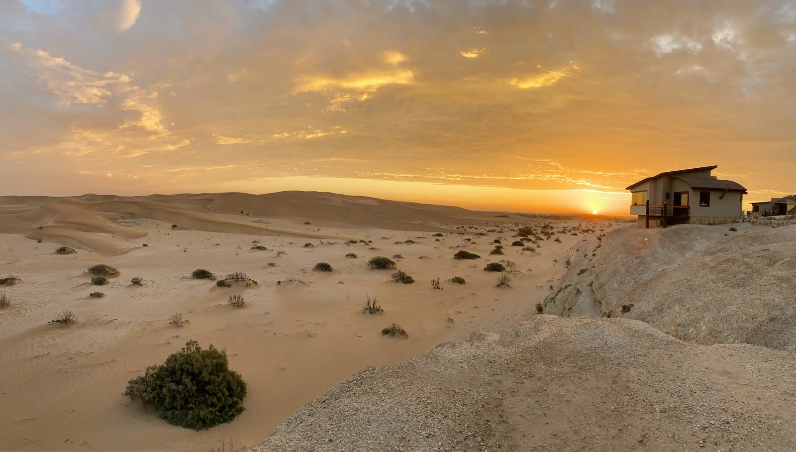 Desert Breeze bungalow and sunrise over the dunes