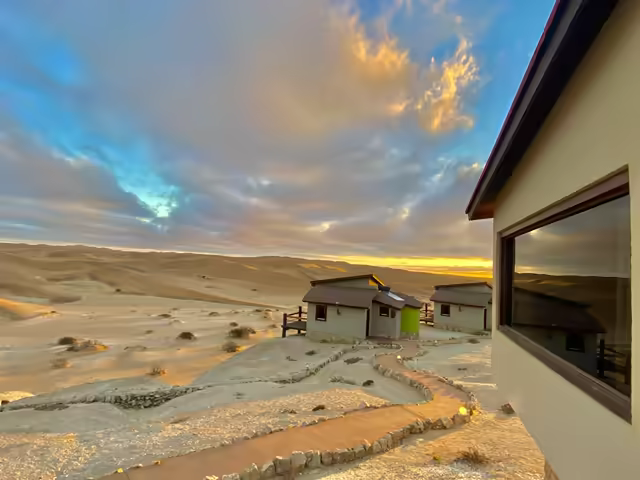 The Stiltz bungalows and raised walkways at dusk