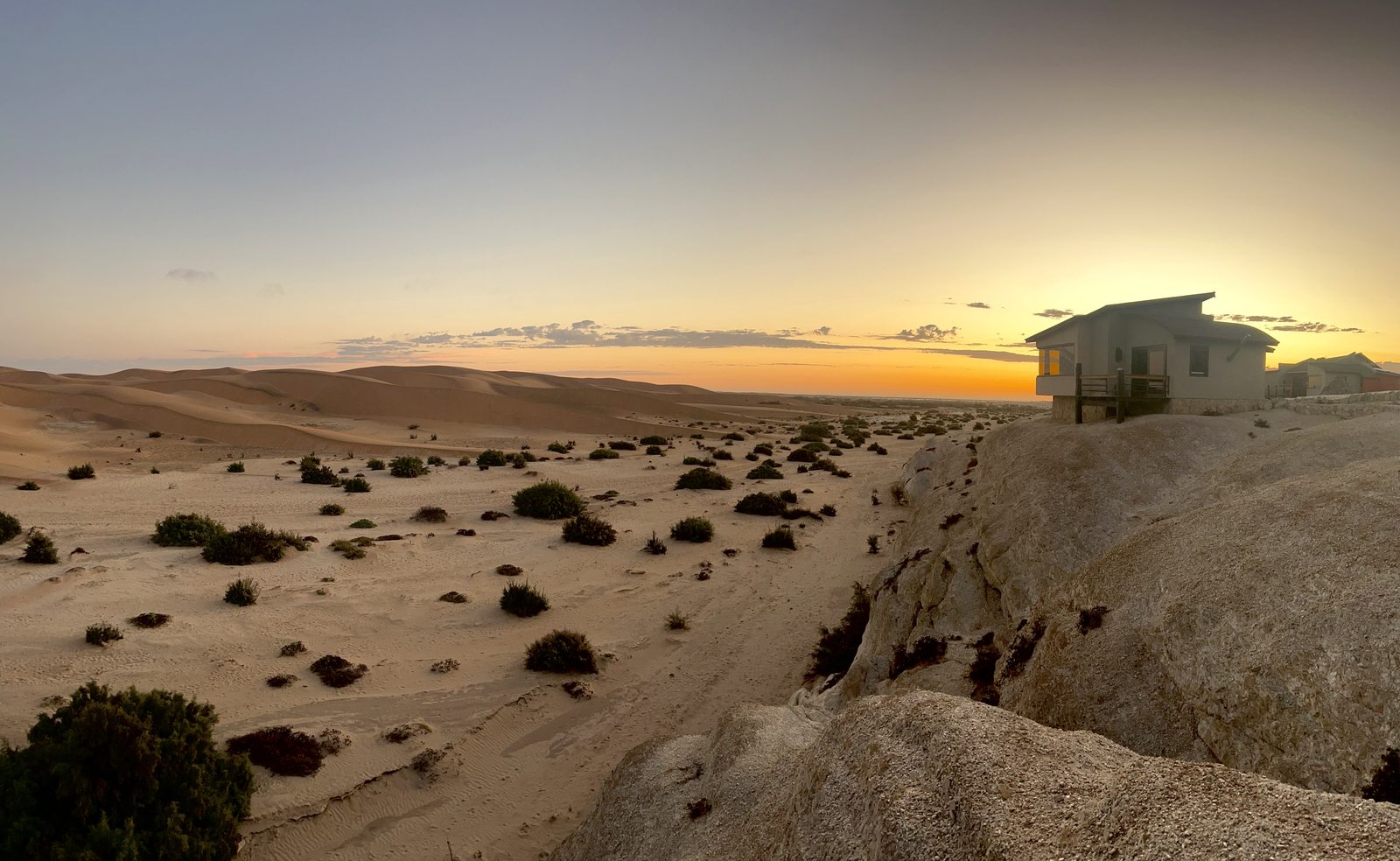 Desert Breeze bungalow overlooking the Namib dunes at sunset